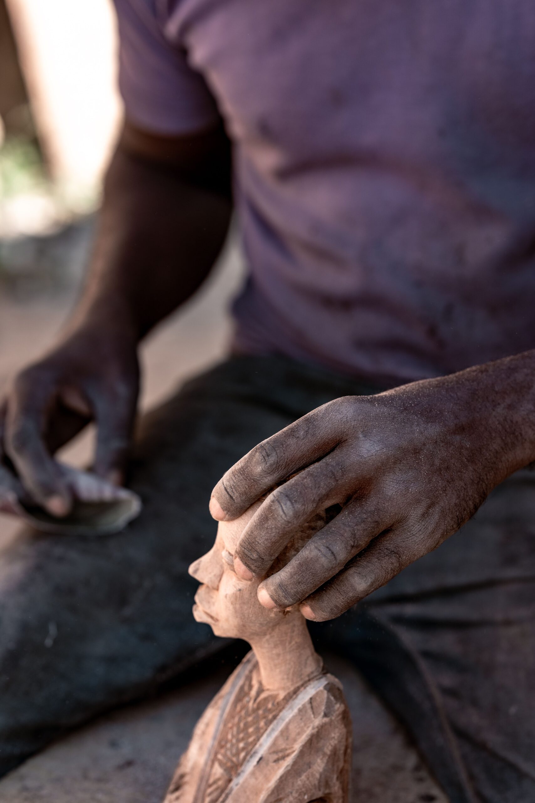 Artisan crafting a wooden sculpture in Nigeria, photo by Solomon Onyeagoro on Pexels