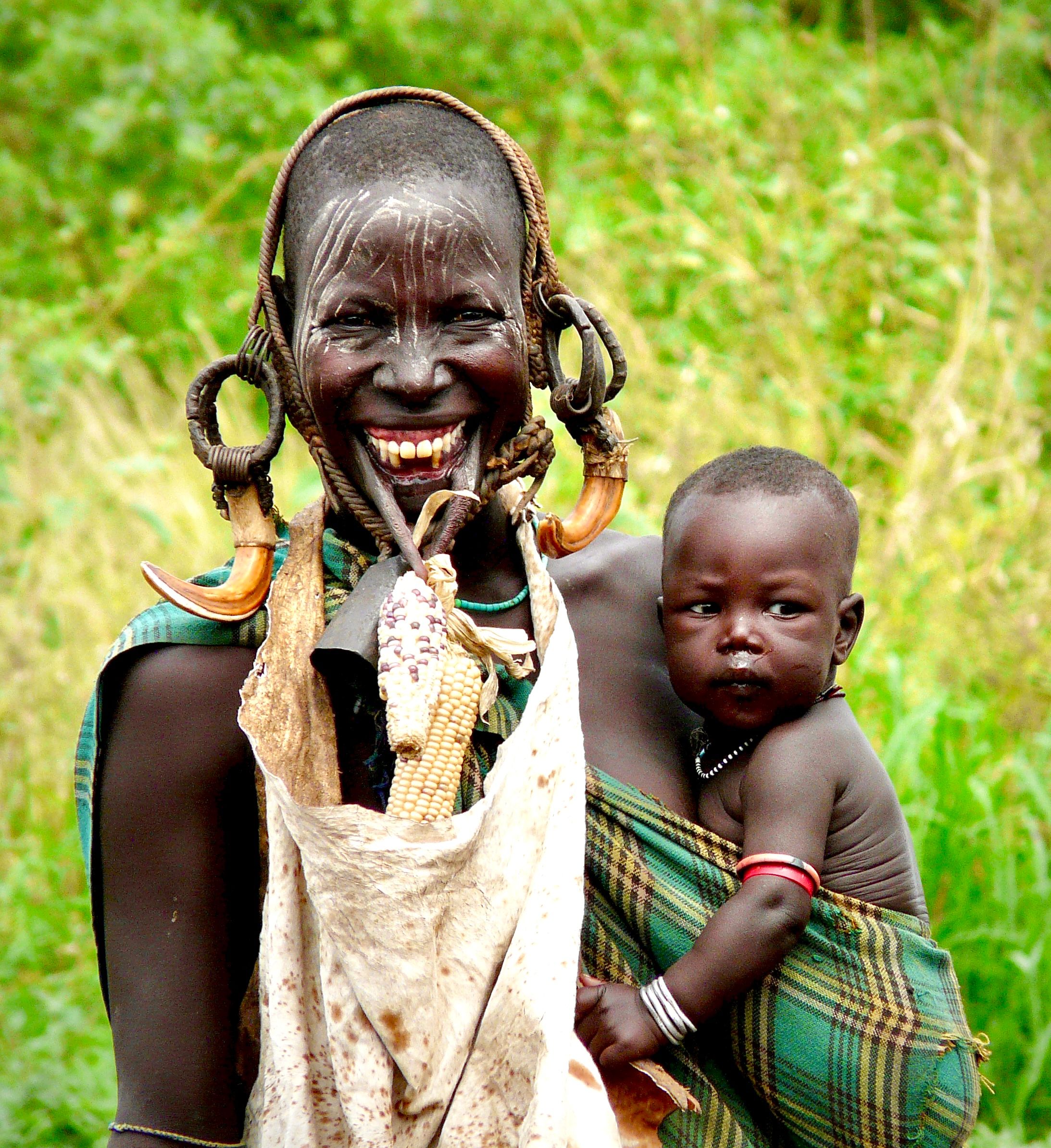 Joyful Mursi tribe mother and child in Ethiopia, photo by Carmen Soler on Pexels