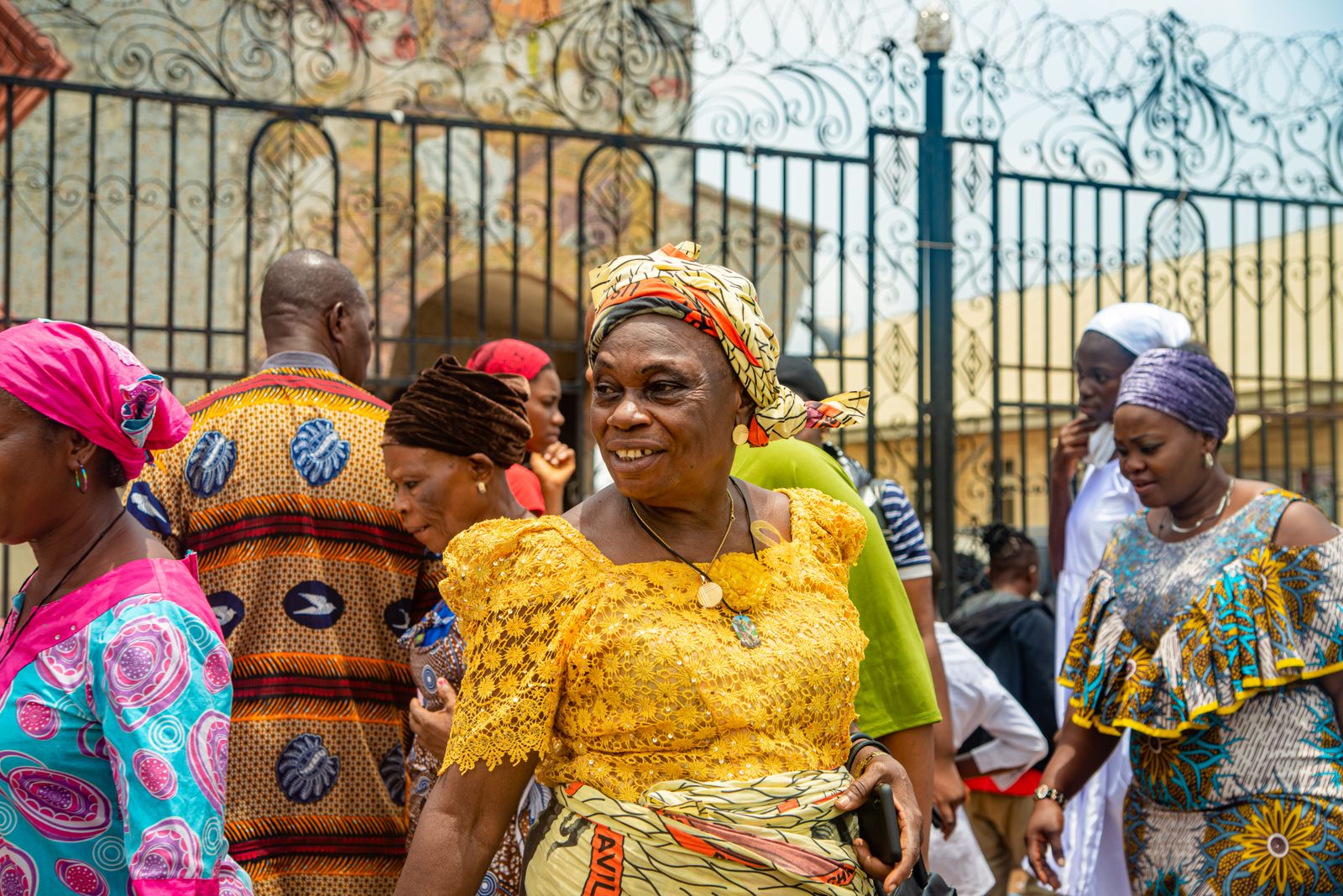 People in traditional Edo dress on a street in Benin City, Nigeria