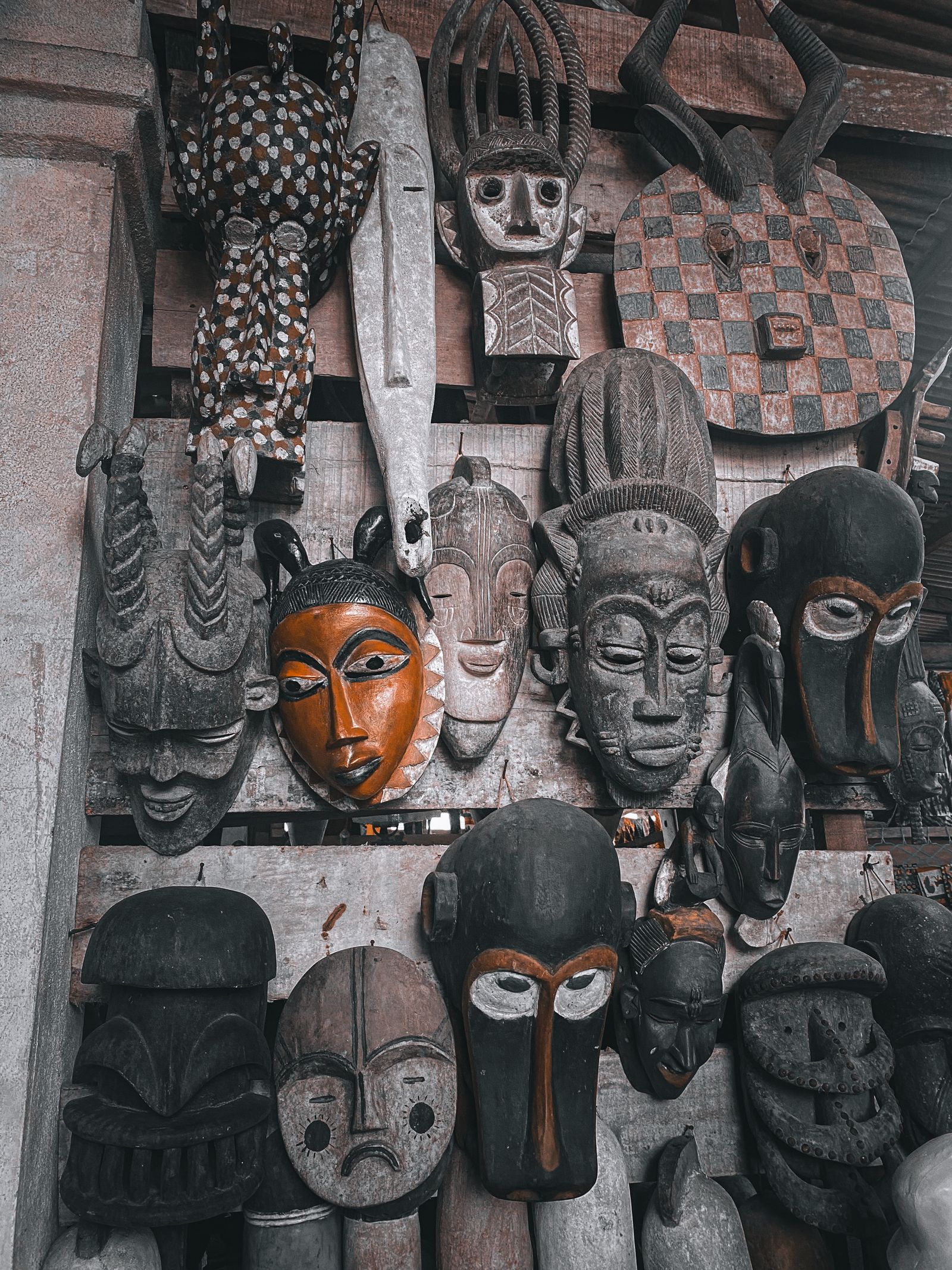African masks on display at a market in Abidjan